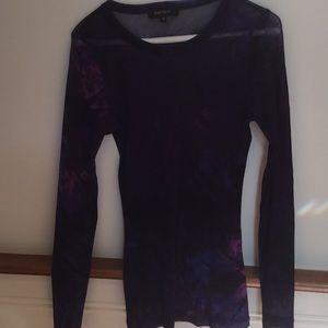 Sheer top. Great with a black cami underneath.